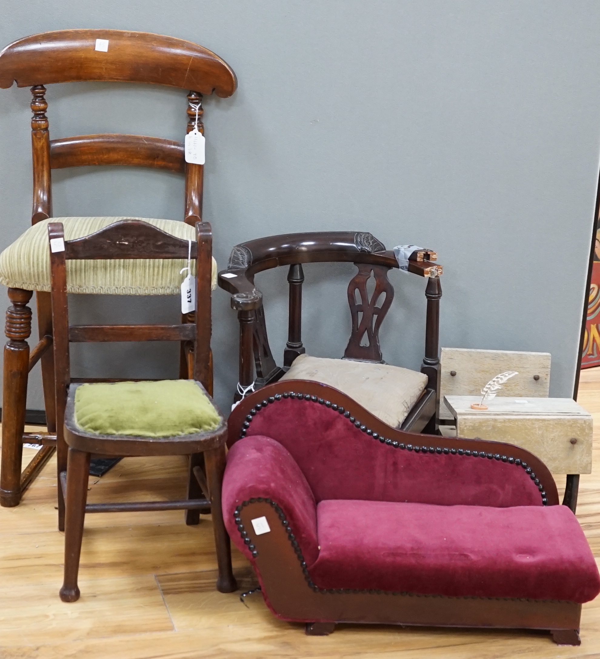 A tall mahogany chair for a doll, together with six pieces of doll's furniture including a chaise longue